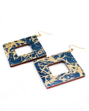 X-Large wooden hollow square diamond shaped earrings featuring metallic gold fibers in the style of traditional unryu paper on a dark blue background.