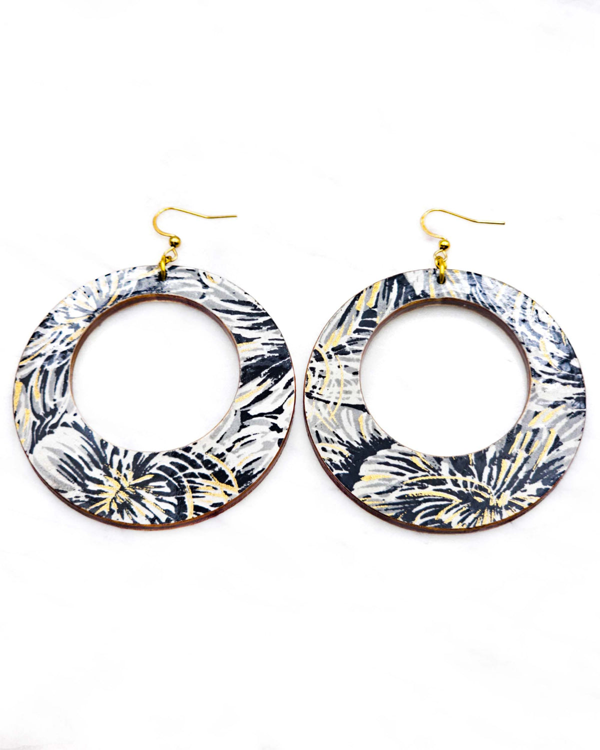 X-Large wooden round hoop shaped earrings featuring large black and gray chrysanthemums on a black background with metallic gold details.