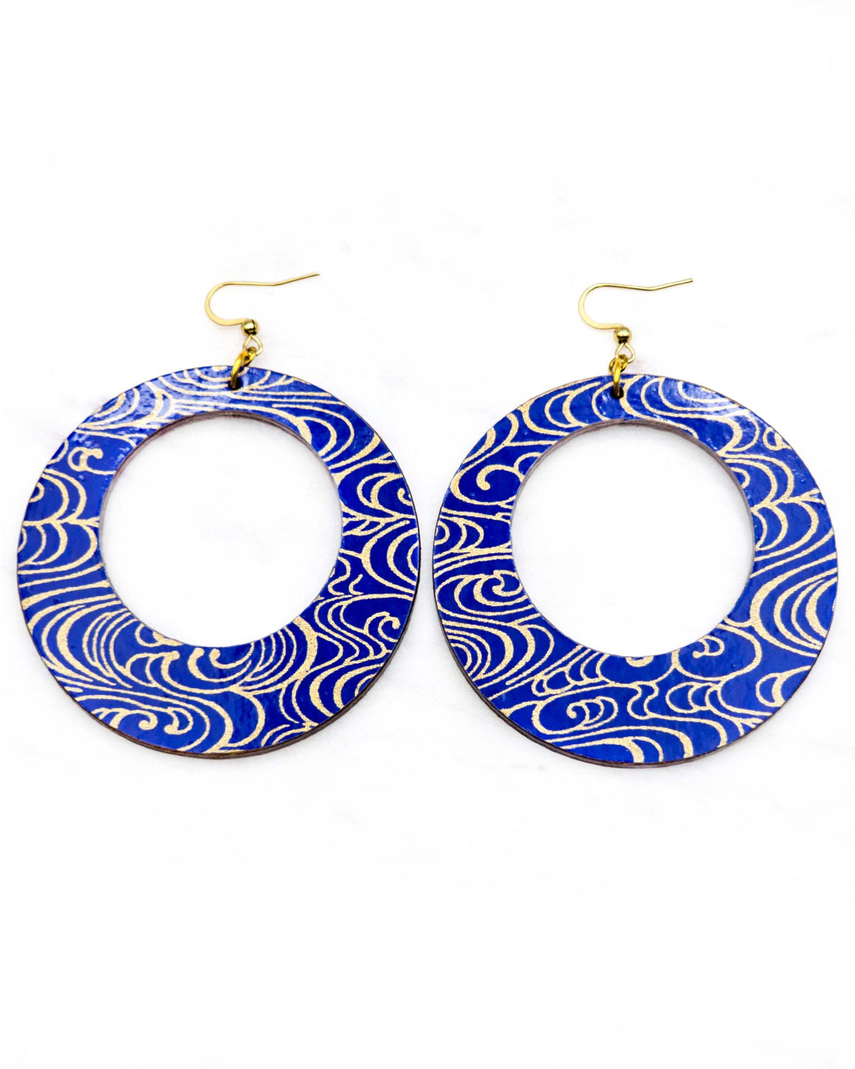 X-Large wooden round hoop shaped earrings featuring metallic gold water ripples on a dark blue background.