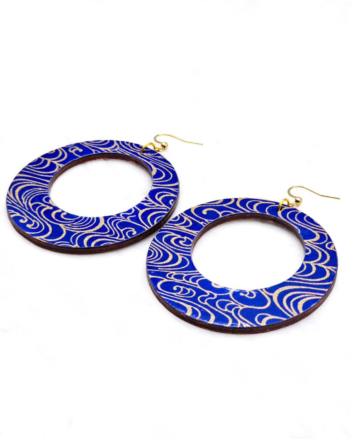 X-Large wooden round hoop shaped earrings featuring metallic gold water ripples on a dark blue background.