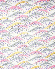 Japanese chiyogami paper featuring pink, gray, and gold hills with purple, pink, and white cherry blossoms on a white background with metallic gold details.