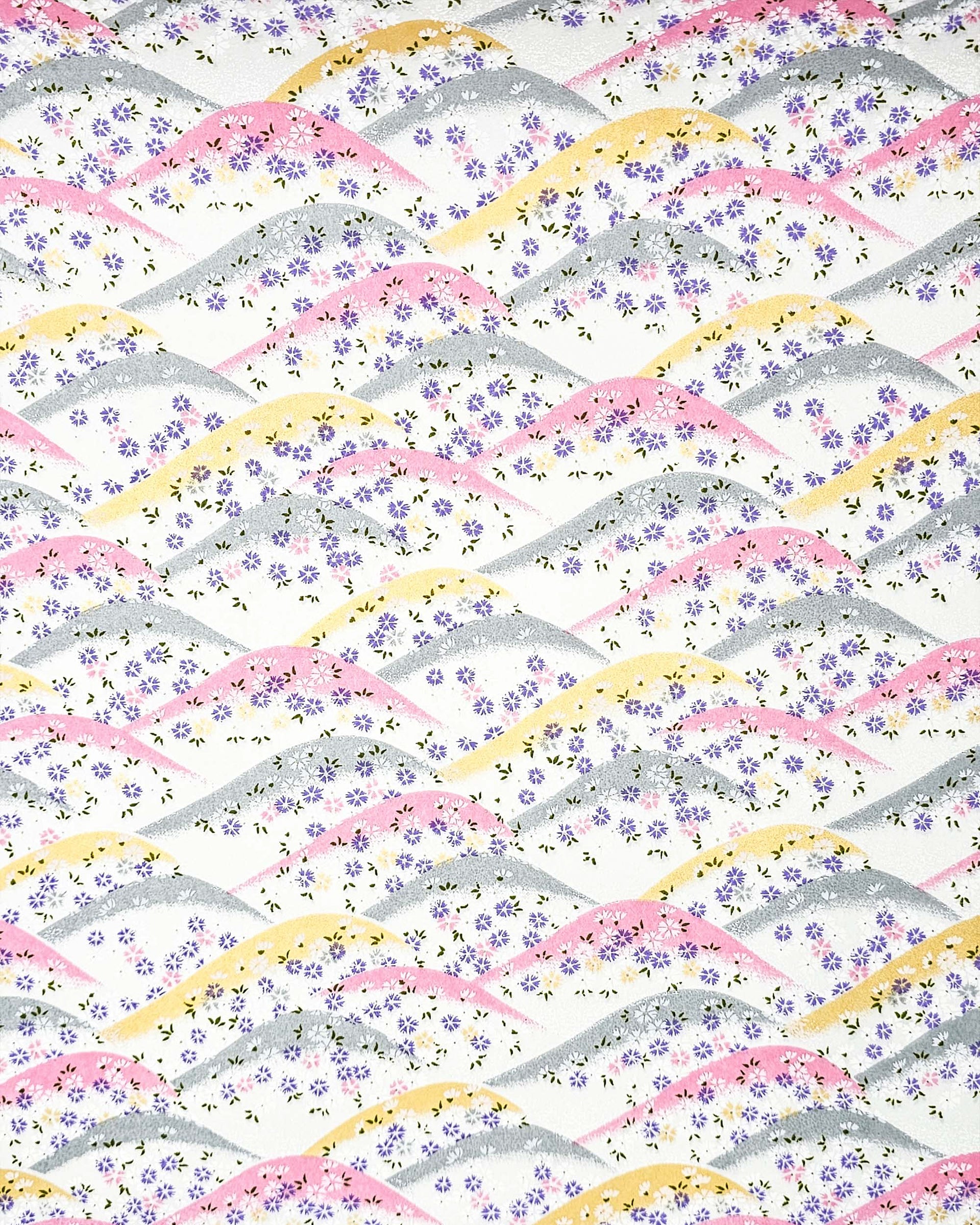 Japanese chiyogami paper featuring pink, gray, and gold hills with purple, pink, and white cherry blossoms on a white background with metallic gold details.