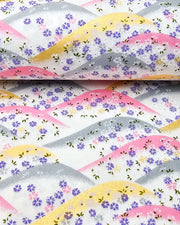 Japanese chiyogami paper featuring pink, gray, and gold hills with purple, pink, and white cherry blossoms on a white background with metallic gold details