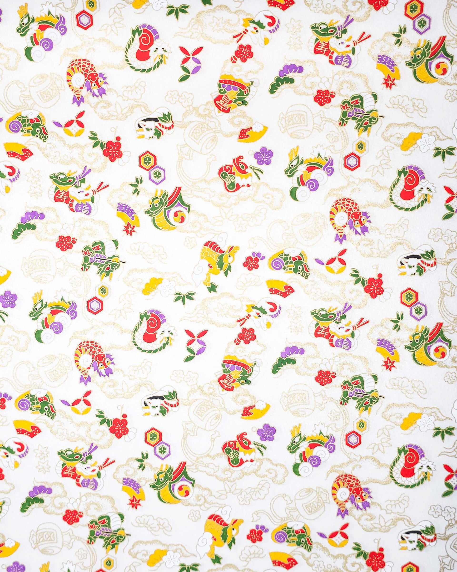 Japanese chiyogami paper featuring assorted white, purple, green, red, and yellow dragons on a shimmering pearlescent white background with metallic gold details.