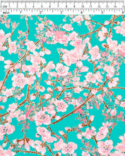 Japanese chiyogami paper featuring pink and white detailed plum blossoms with brown branches and green leaves on a turquoise background with metallic gold details.