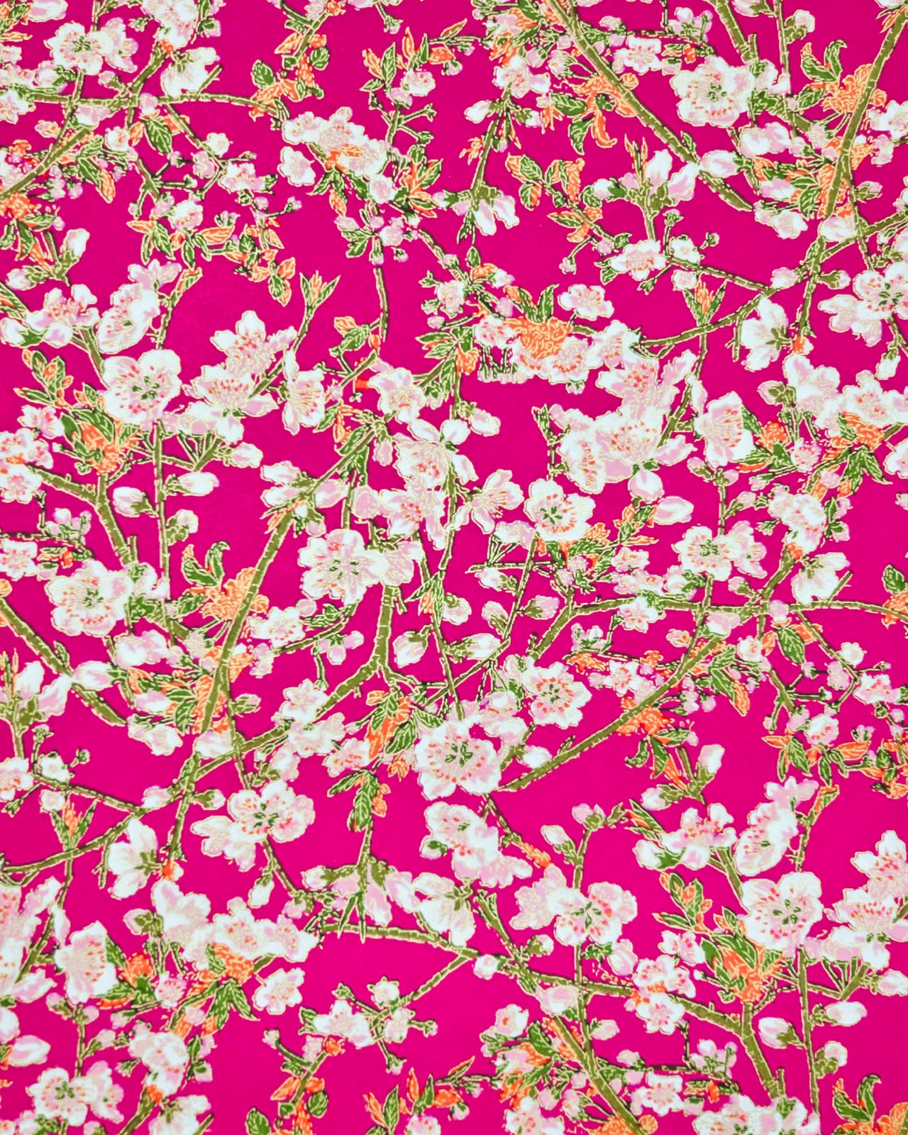 Japanese chiyogami paper featuring pink and white detailed plum blossoms with brown branches and green leaves on a magenta pink background with metallic gold details.