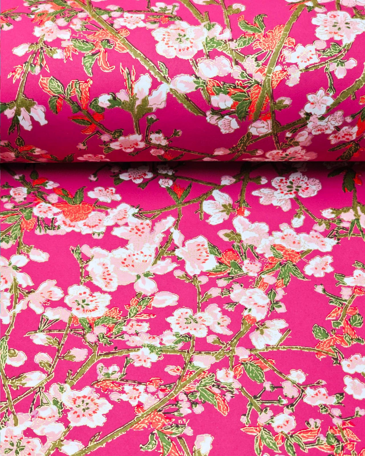 Japanese chiyogami paper featuring pink and white detailed plum blossoms with brown branches and green leaves on a magenta pink background with metallic gold details.