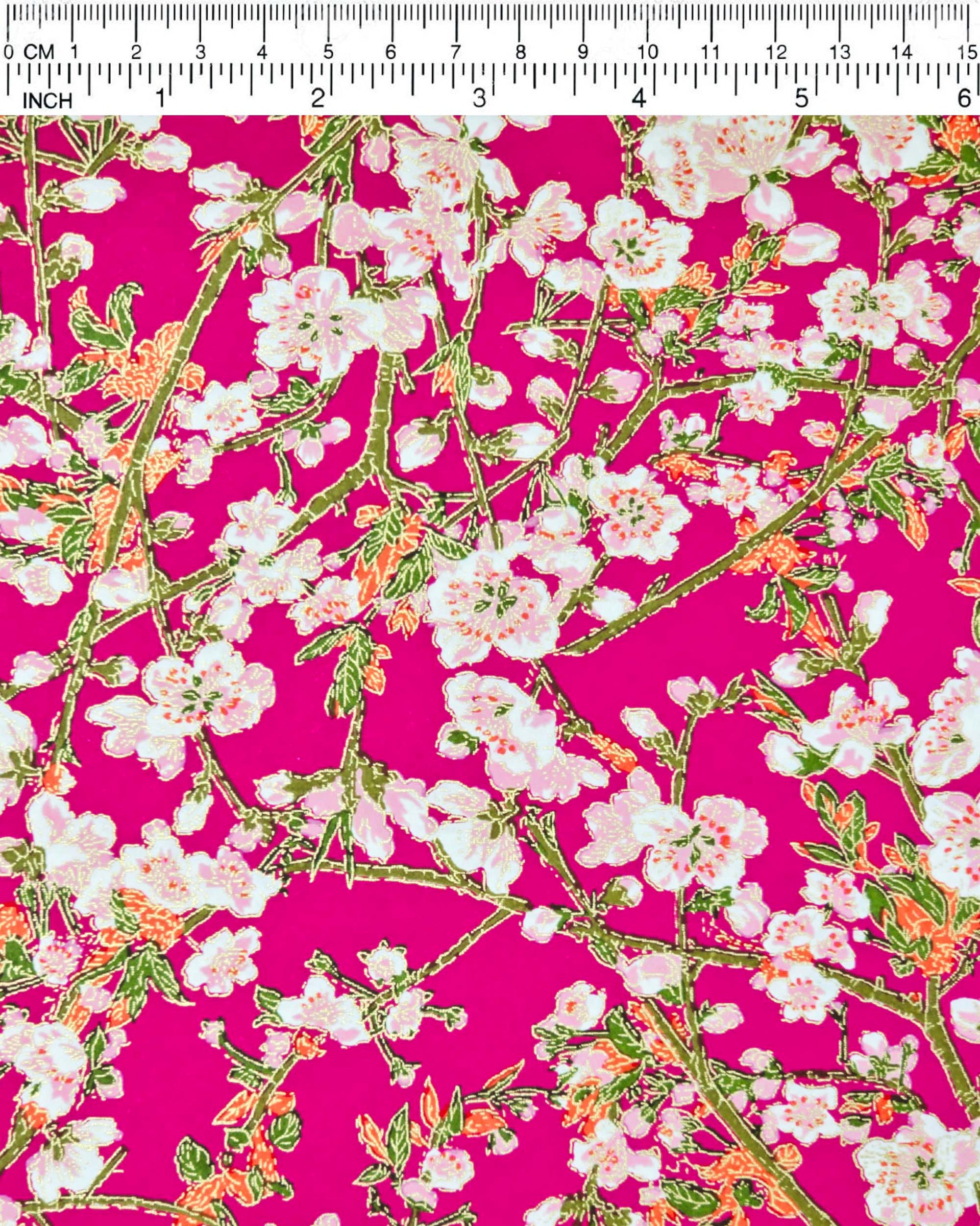 Japanese chiyogami paper featuring pink and white detailed plum blossoms with brown branches and green leaves on a magenta pink background with metallic gold details.