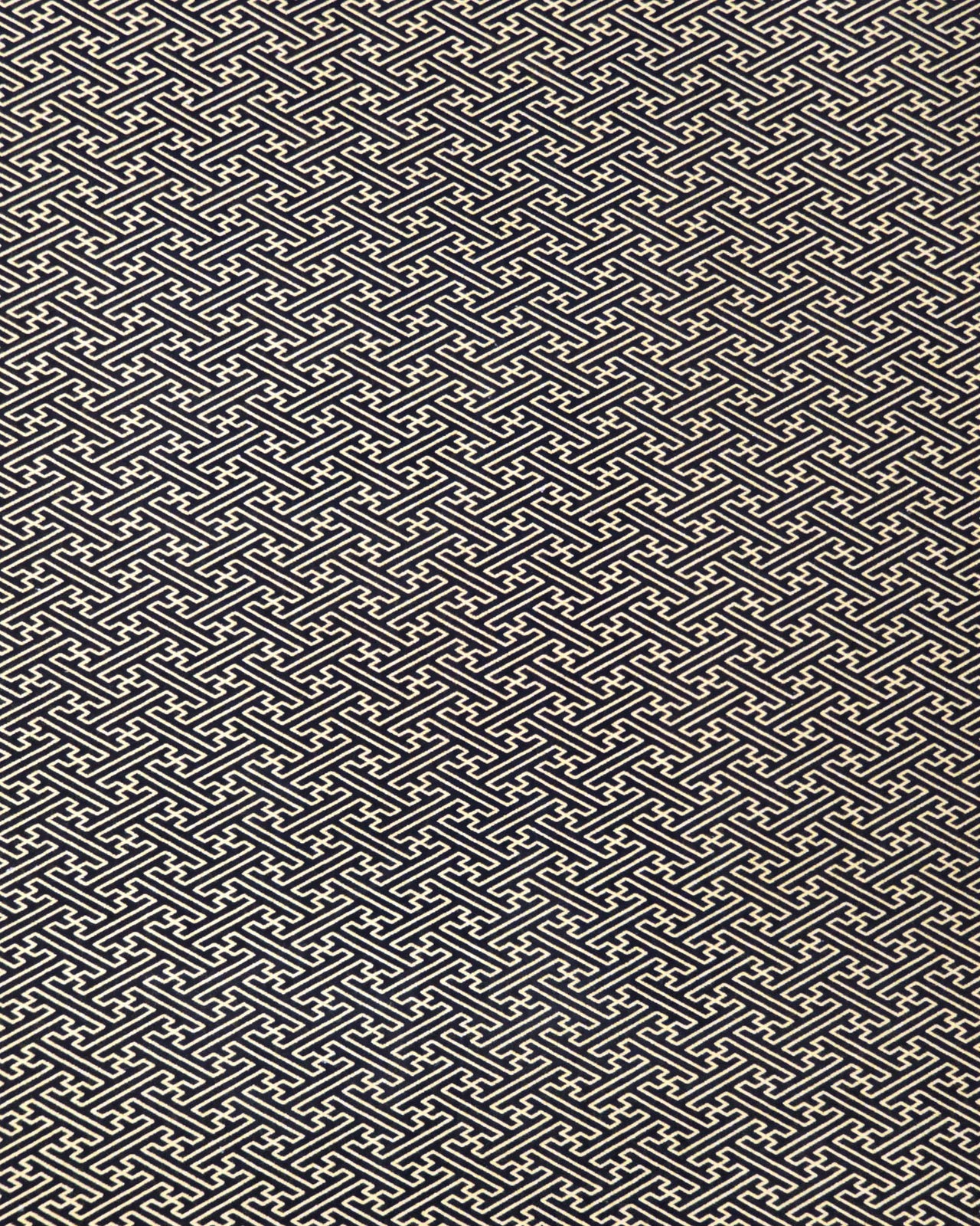 Japanese chiyogami paper featuring a metallic gold traditional Japanese sayagata design on a black background.