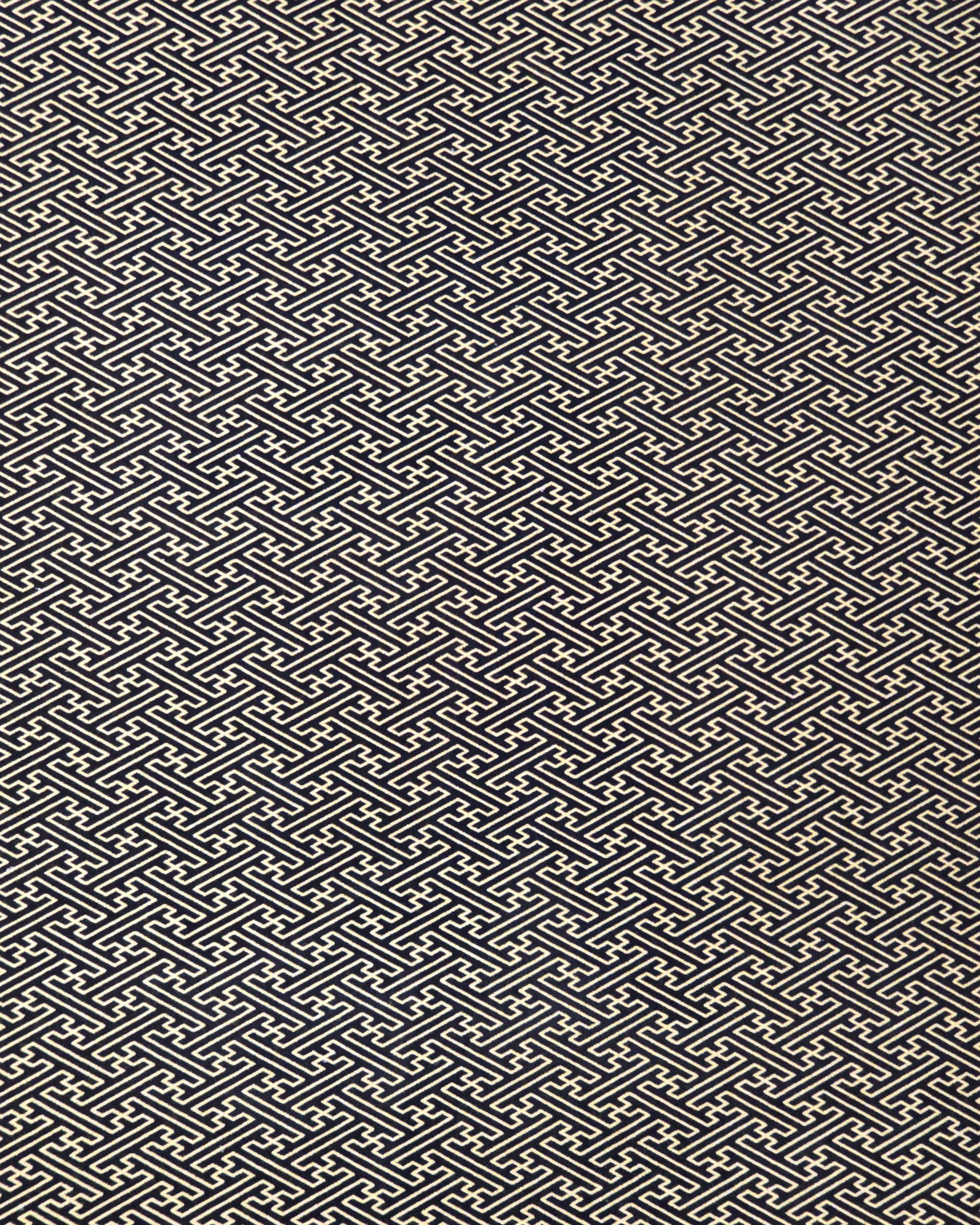 Japanese chiyogami paper featuring a metallic gold traditional Japanese sayagata design on a black background.