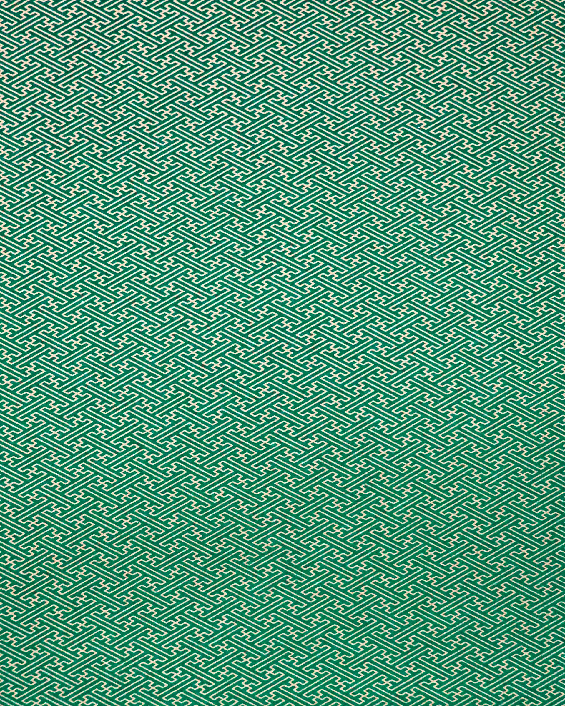 Japanese chiyogami paper featuring a small metallic gold traditional Japanese sayagata design on a green background.