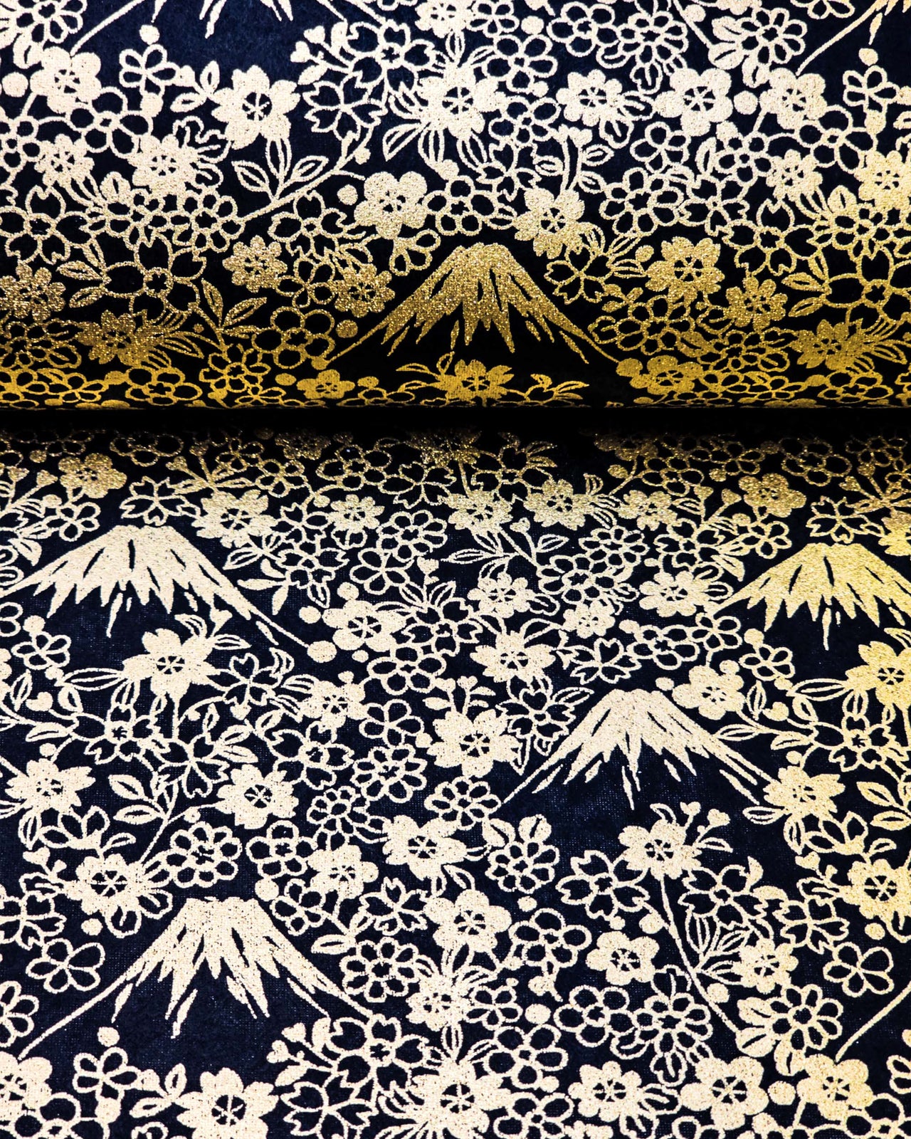 Japanese chiyogami paper featuring metallic gold Mt Fuji and cherry blossoms on a black background.