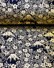 Japanese chiyogami paper featuring metallic gold Mt Fuji and cherry blossoms on a black background.