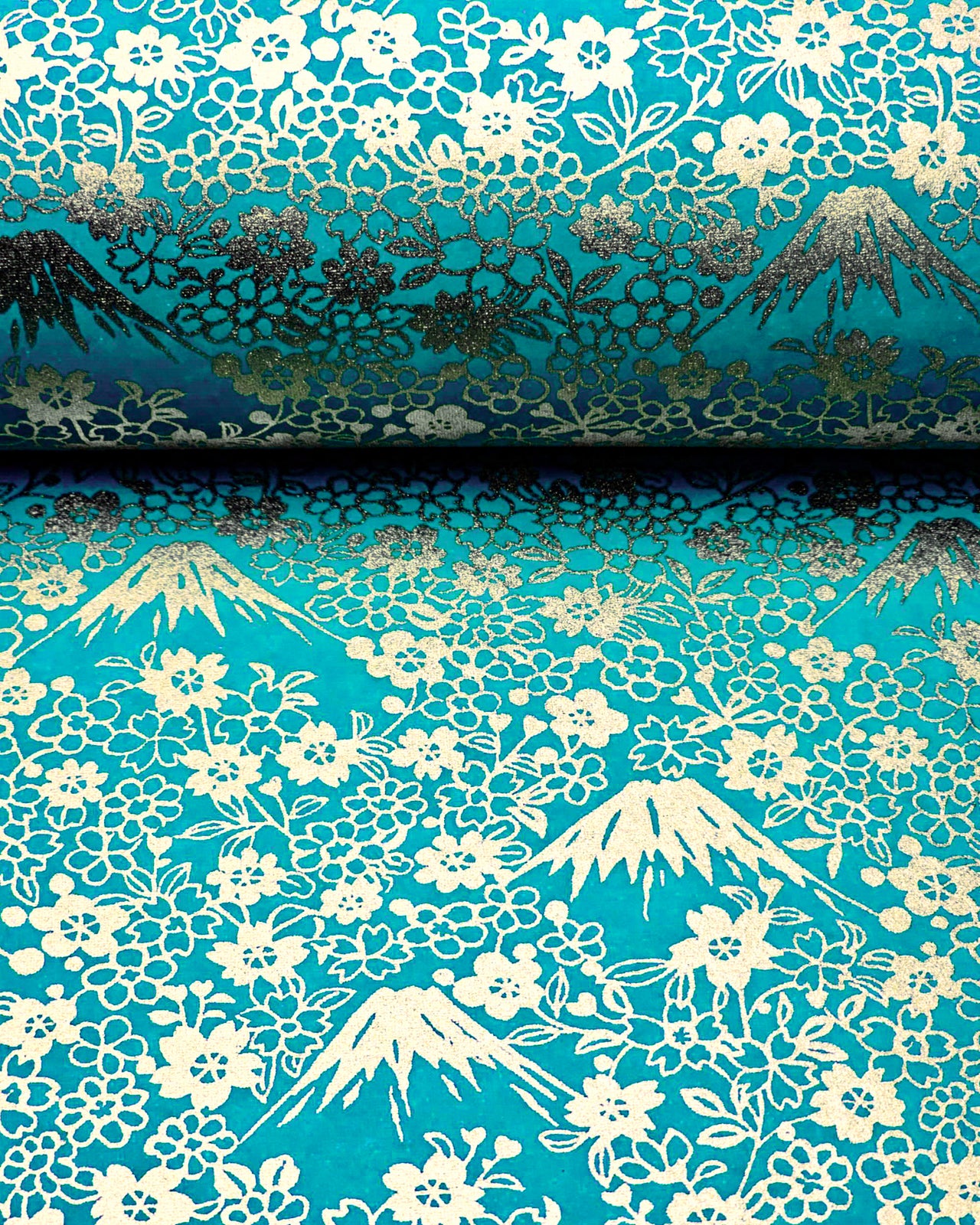 Japanese chiyogami paper featuring metallic gold Mt Fuji and cherry blossoms on a teal blue background.