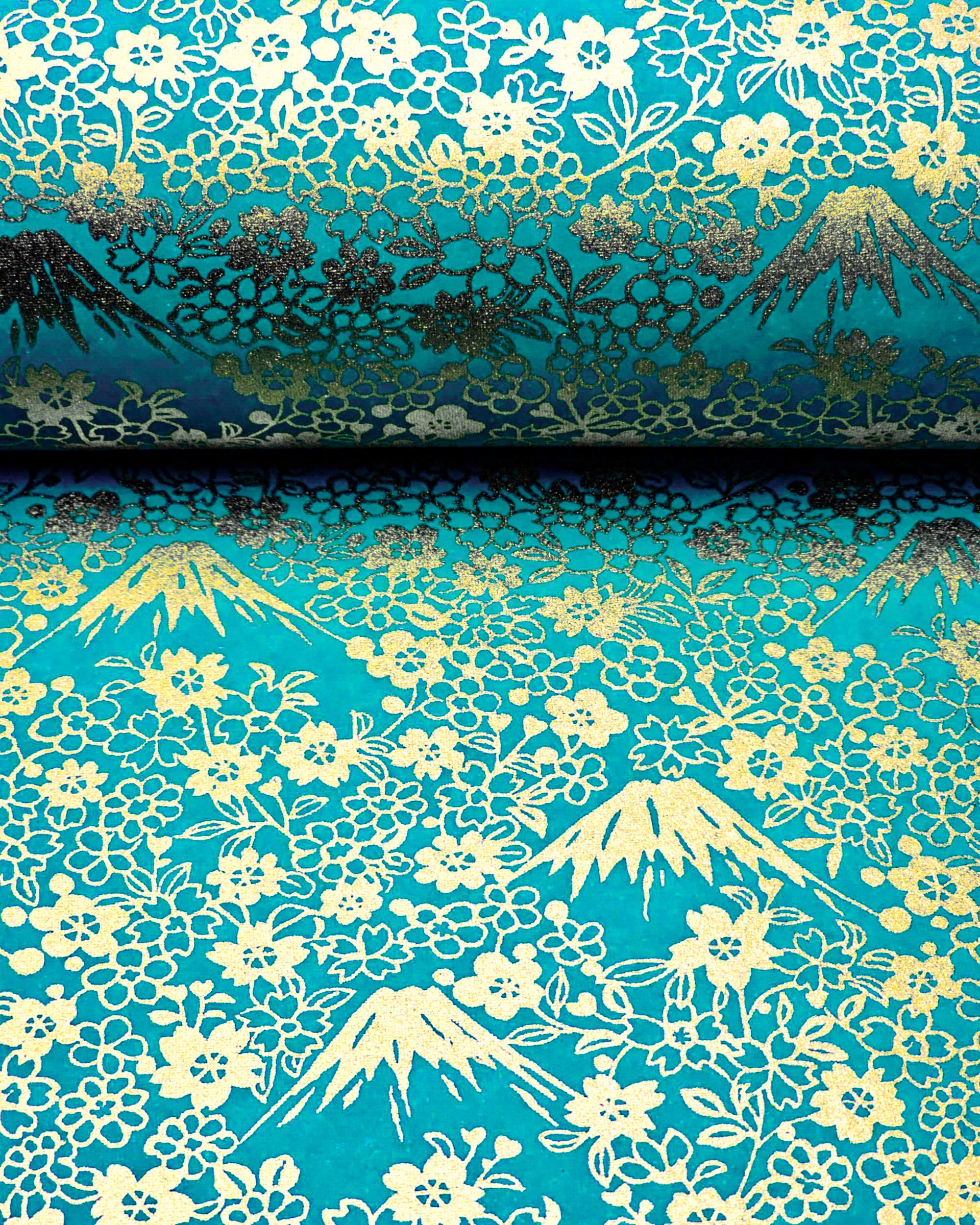 Japanese chiyogami paper featuring metallic gold Mt Fuji and cherry blossoms on a teal blue background.
