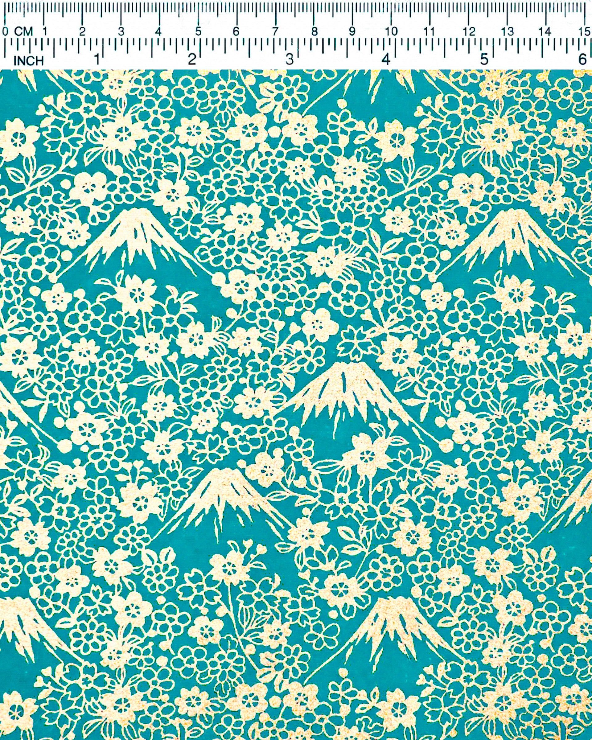 Japanese chiyogami paper featuring metallic gold Mt Fuji and cherry blossoms on a teal blue background.
