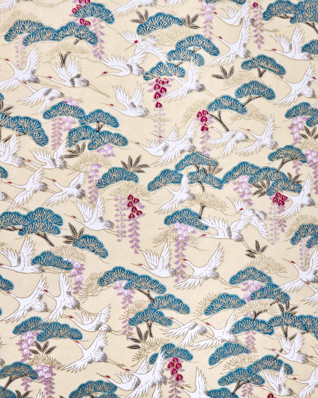 Japanese chiyogami paper featuring white flying cranes, purple and red wisteria, and green pine on a light shimmering gold background with metallic gold details.