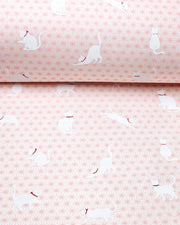 Japanese chiyogami paper featuring assorted white cats with red collars on a light pink asanoha (hemp leaf) background.