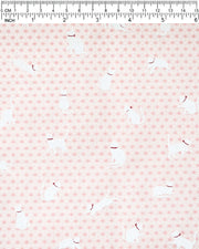 Japanese chiyogami paper featuring assorted white cats with red collars on a light pink asanoha (hemp leaf) background.