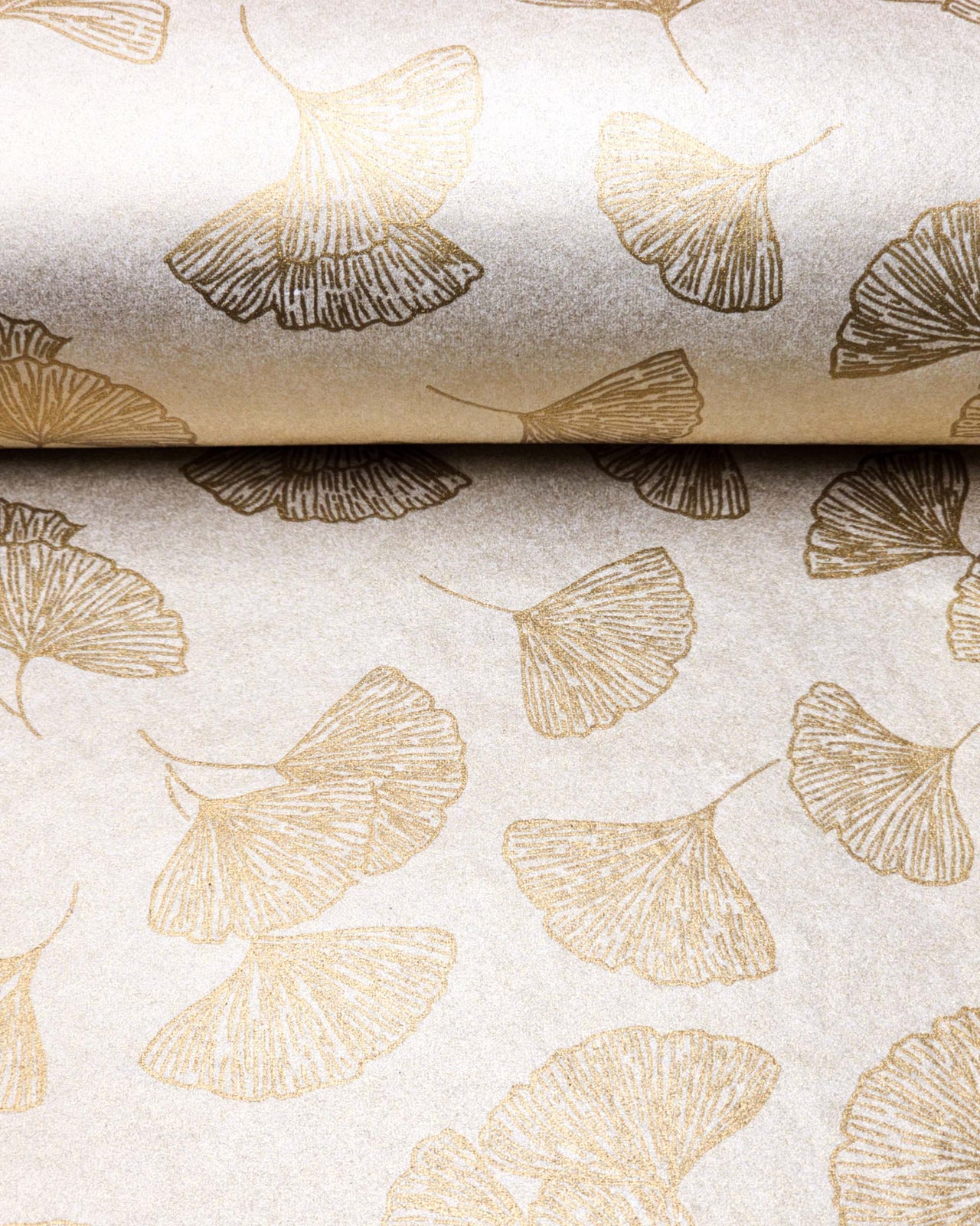 Japanese chiyogami paper featuring large metallic gold gingko leaves on a light shimmering gold background.