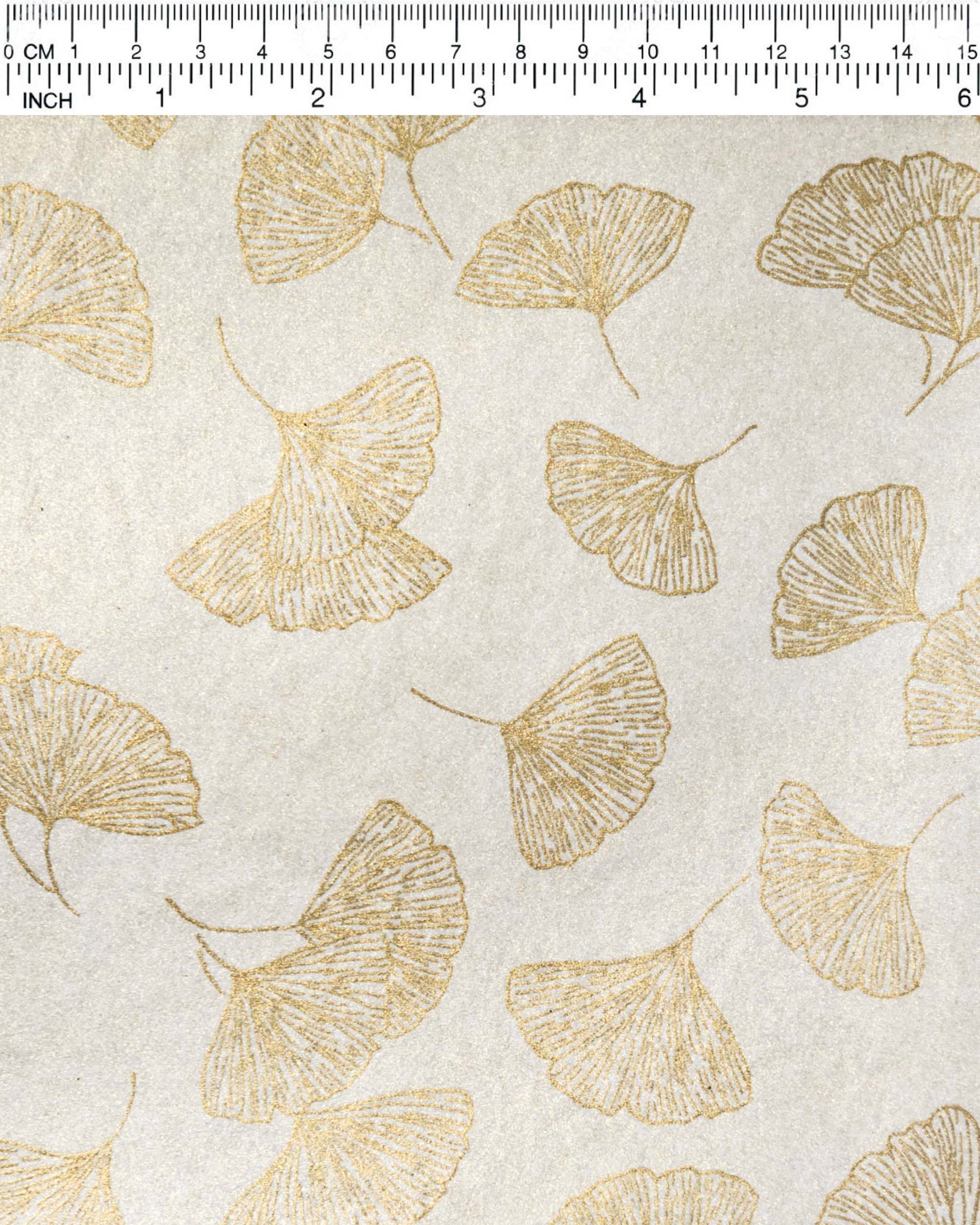Japanese chiyogami paper featuring large metallic gold gingko leaves on a light shimmering gold background.