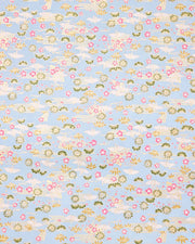 Japanese chiyogami paper featuring white origami cranes with green plants and pink plum blossoms on a light blue background with metallic gold details.