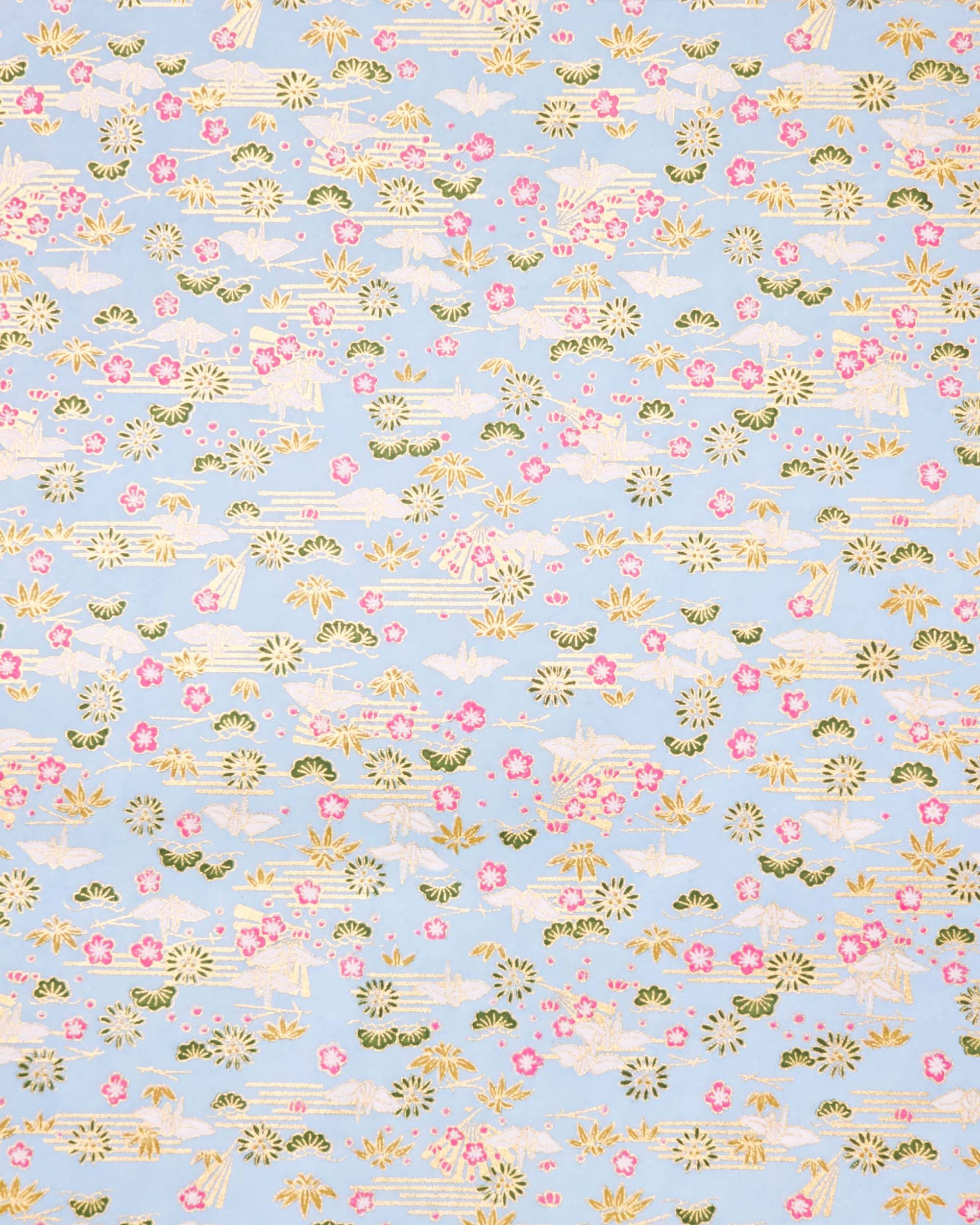 Japanese chiyogami paper featuring white origami cranes with green plants and pink plum blossoms on a light blue background with metallic gold details.