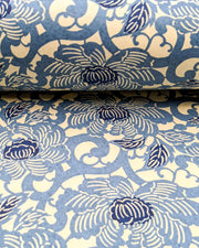 Japanese chiyogami paper featuring large blue peonies on a cream background.