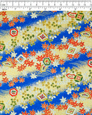 Japanese chiyogami paper featuring red and white maple leaves and traditional motifs on a blue and gold background with metallic gold details.