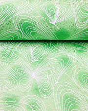 Japanese chiyogami paper featuring white butterfly outlines on a green background with metallic gold details.