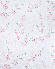 Japanese chiyogami paper featuring pink and white cherry blossoms on a pearlescent pale blue gray background.