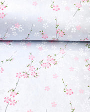 Japanese chiyogami paper featuring pink and white cherry blossoms on a pearlescent pale blue gray background.