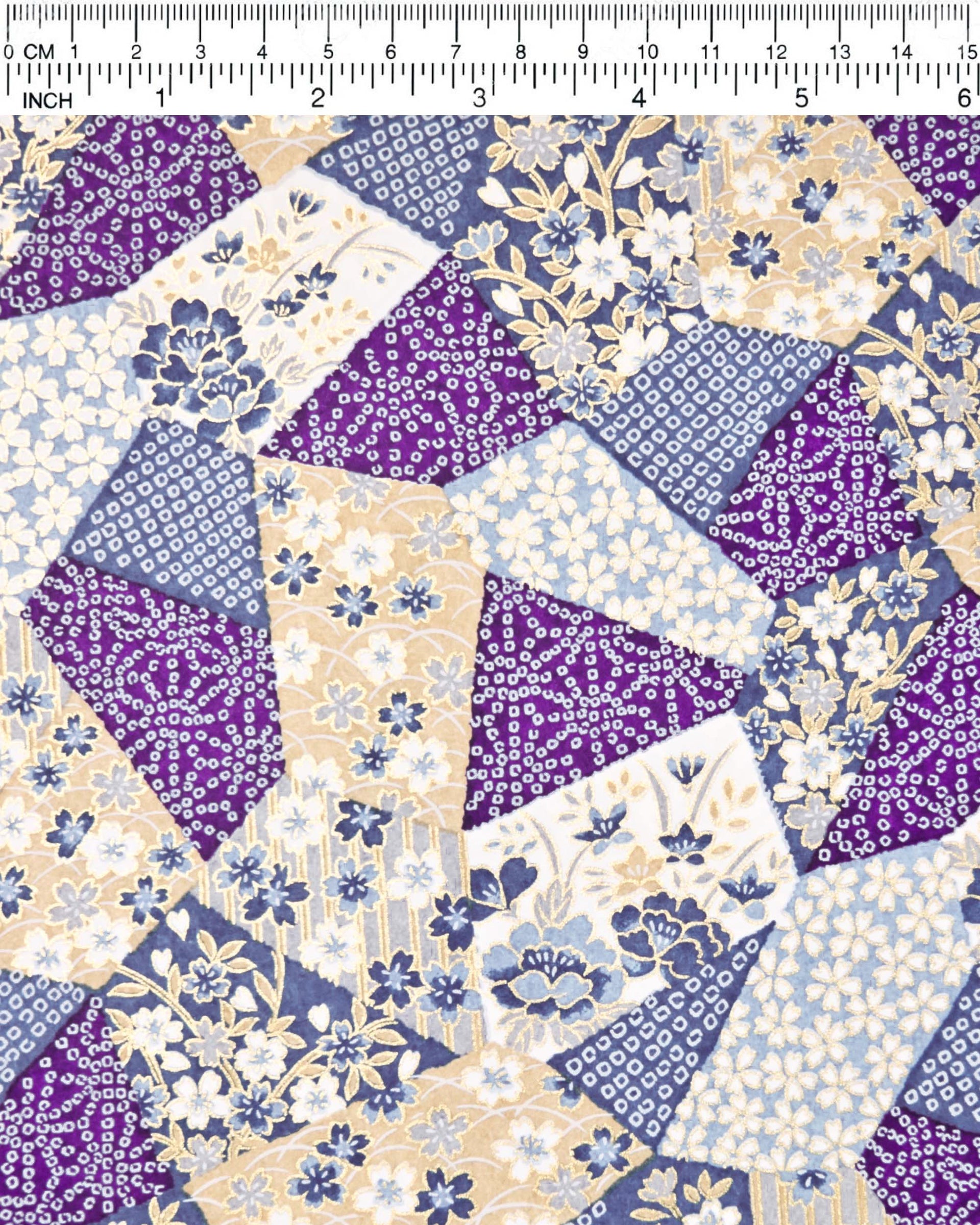 Japanese chiyogami paper featuring blue, beige, white, and purple patches embedded assorted geometric and floral designs with metallic gold details.