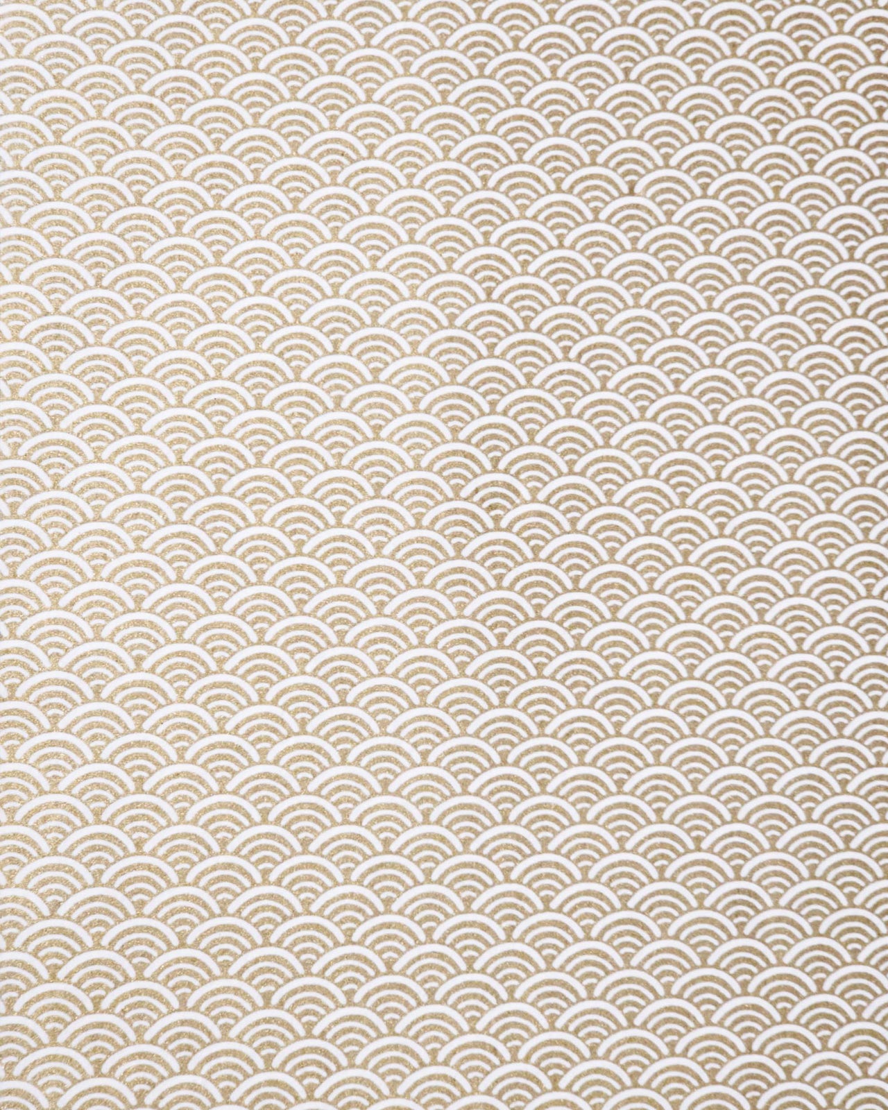 Japanese chiyogami paper featuring a traditional white and metallic gold seigaiha (wave crests) pattern.