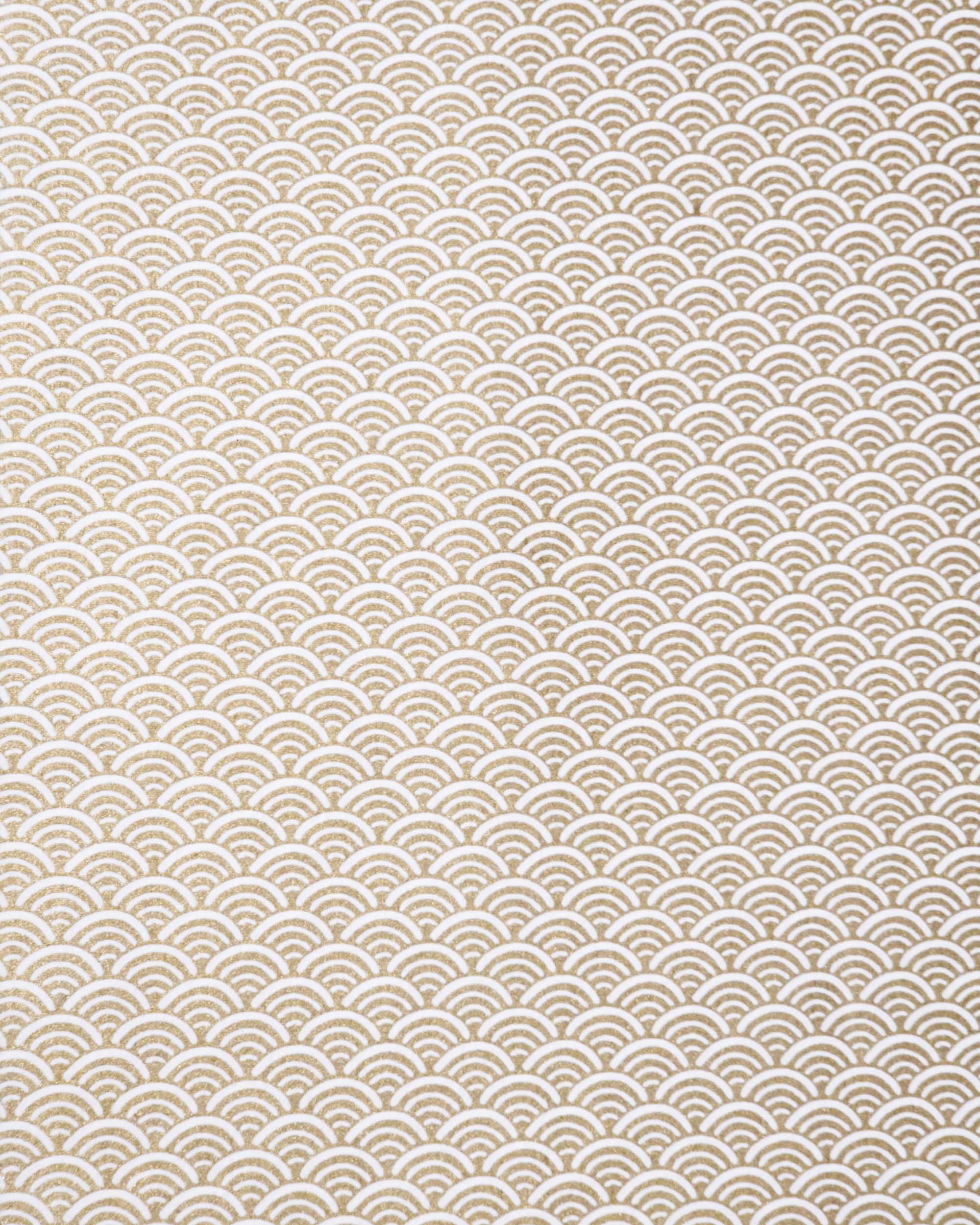 Japanese chiyogami paper featuring a traditional white and metallic gold seigaiha (wave crests) pattern.