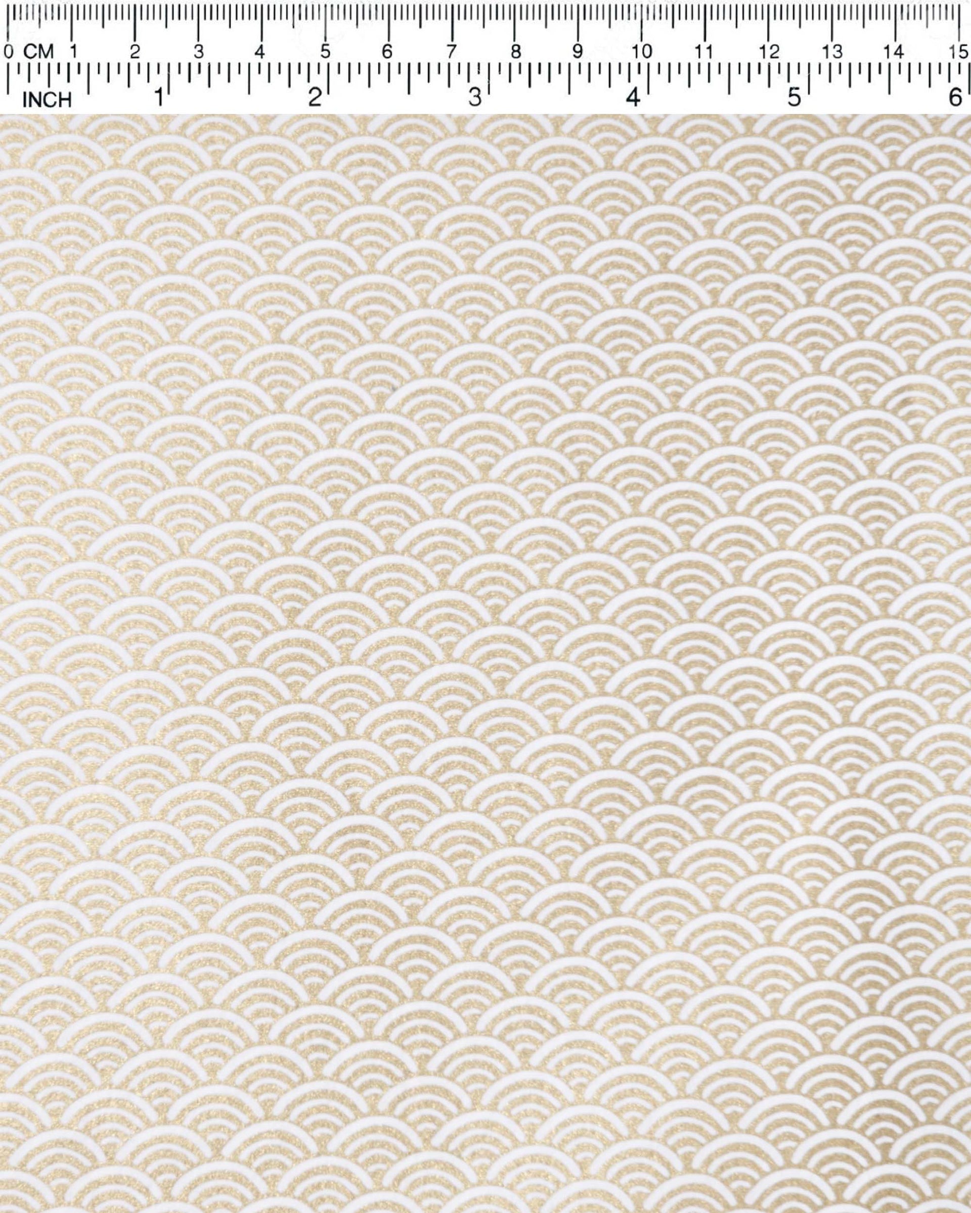 Japanese chiyogami paper featuring a traditional white and metallic gold seigaiha (wave crests) pattern.