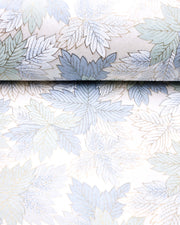 Japanese chiyogami paper featuring large blue, light mint green, and white leaves on a pearlescent white background with metallic gold details.
