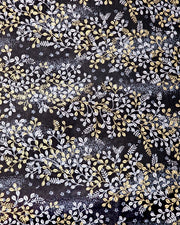 Japanese chiyogami paper featuring metallic gold and silver hagi (bush clover) on a black background.