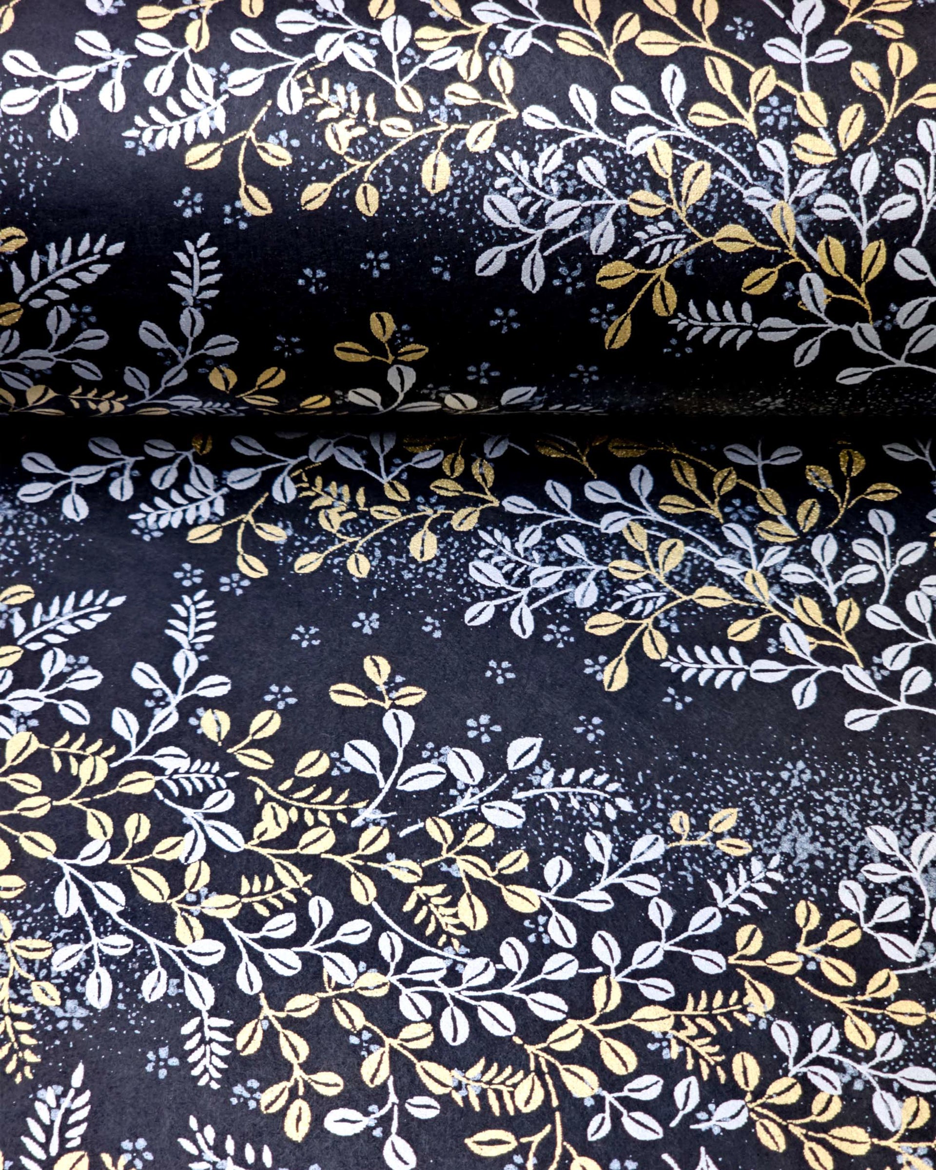 Japanese chiyogami paper featuring metallic gold and silver hagi (bush clover) on a black background.