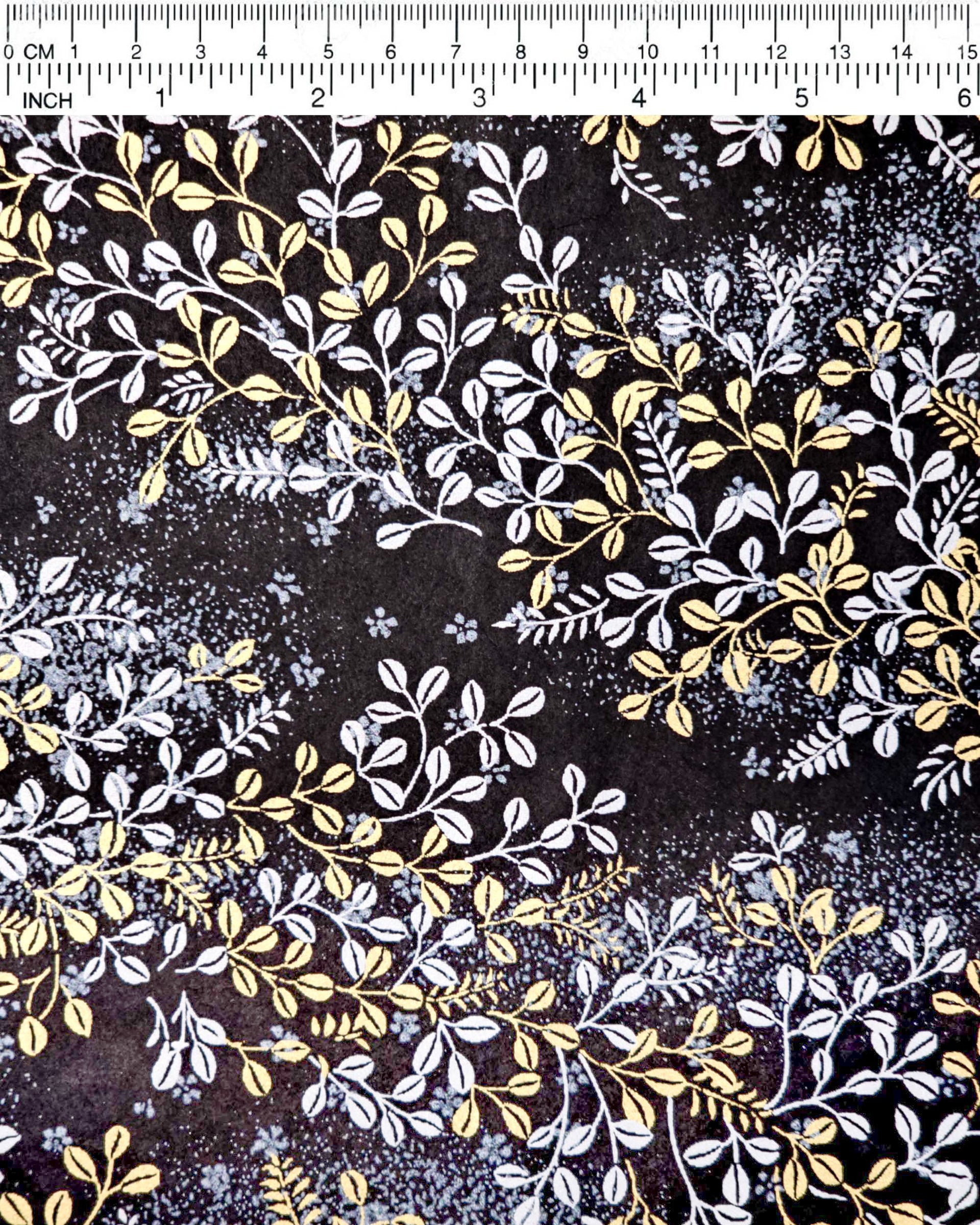 Japanese chiyogami paper featuring metallic gold and silver hagi (bush clover) on a black background.
