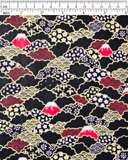 Japanese chiyogami paper featuring red Mt Fuji and gold clouds filled with assorted gold and pink geometric and flower designs on a black background.