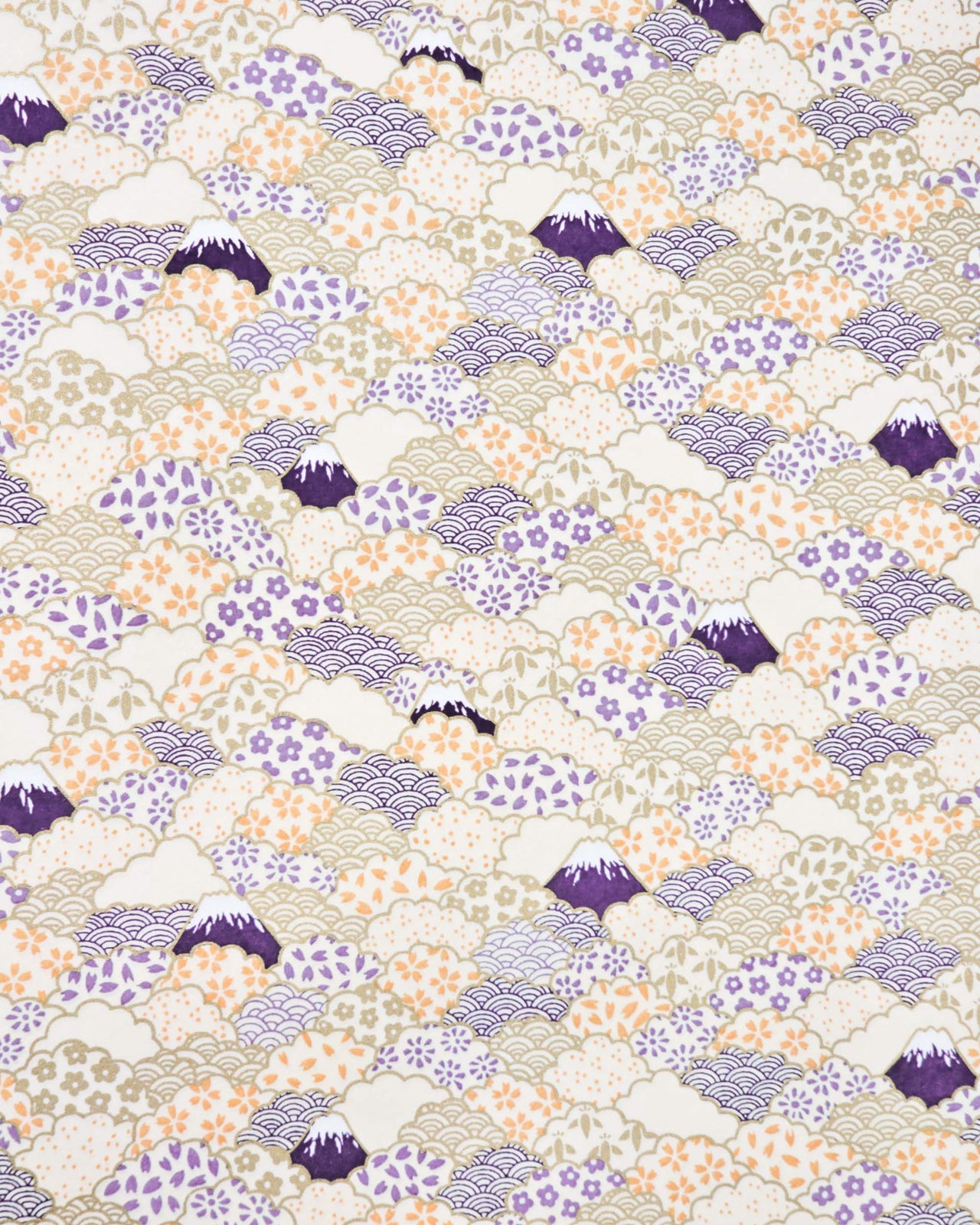 Japanese chiyogami paper featuring dark blue Mt Fuji and gold clouds filled with assorted gold, orange, and purple geometric and flower designs on a white background.