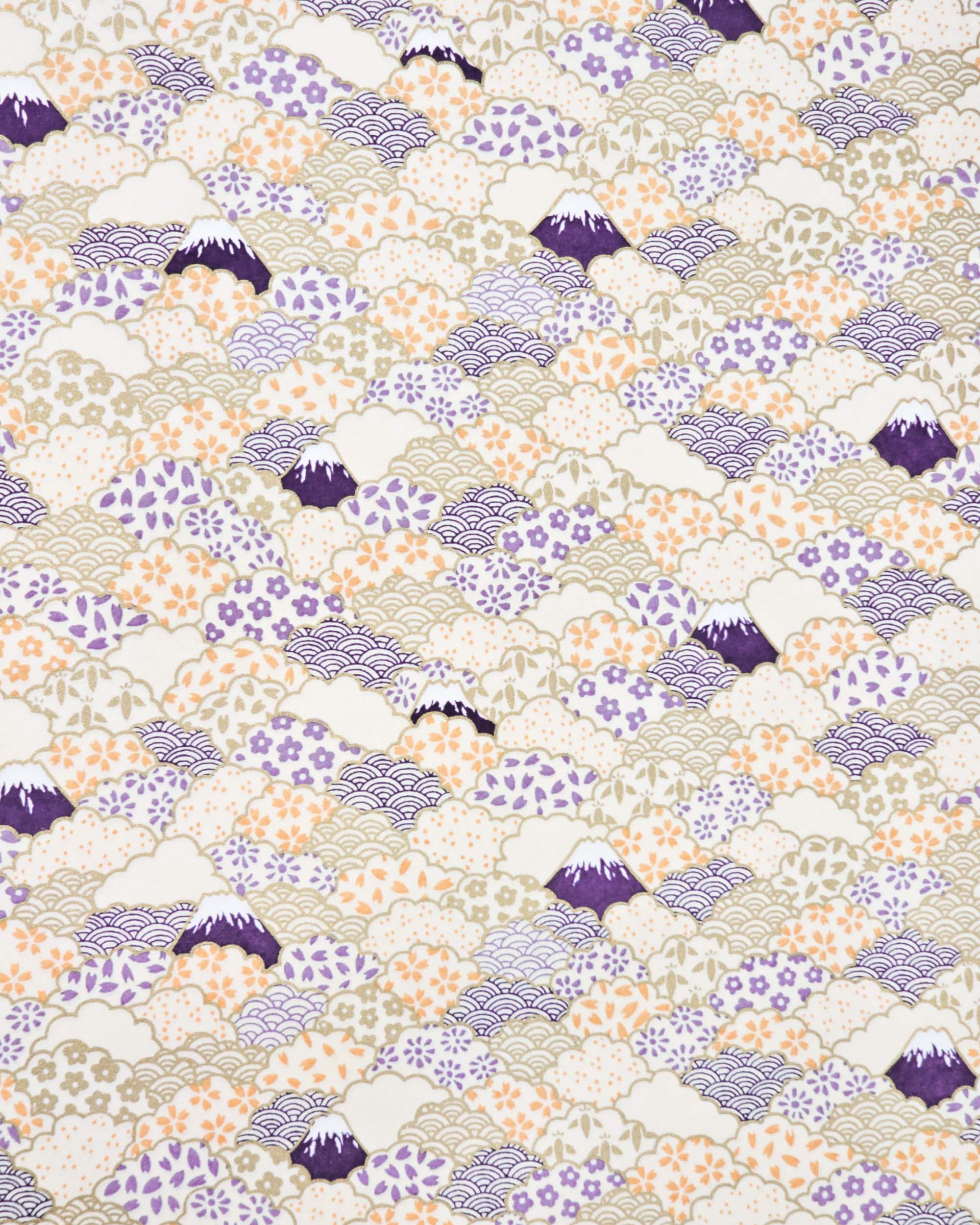 Japanese chiyogami paper featuring dark blue Mt Fuji and gold clouds filled with assorted gold, orange, and purple geometric and flower designs on a white background.