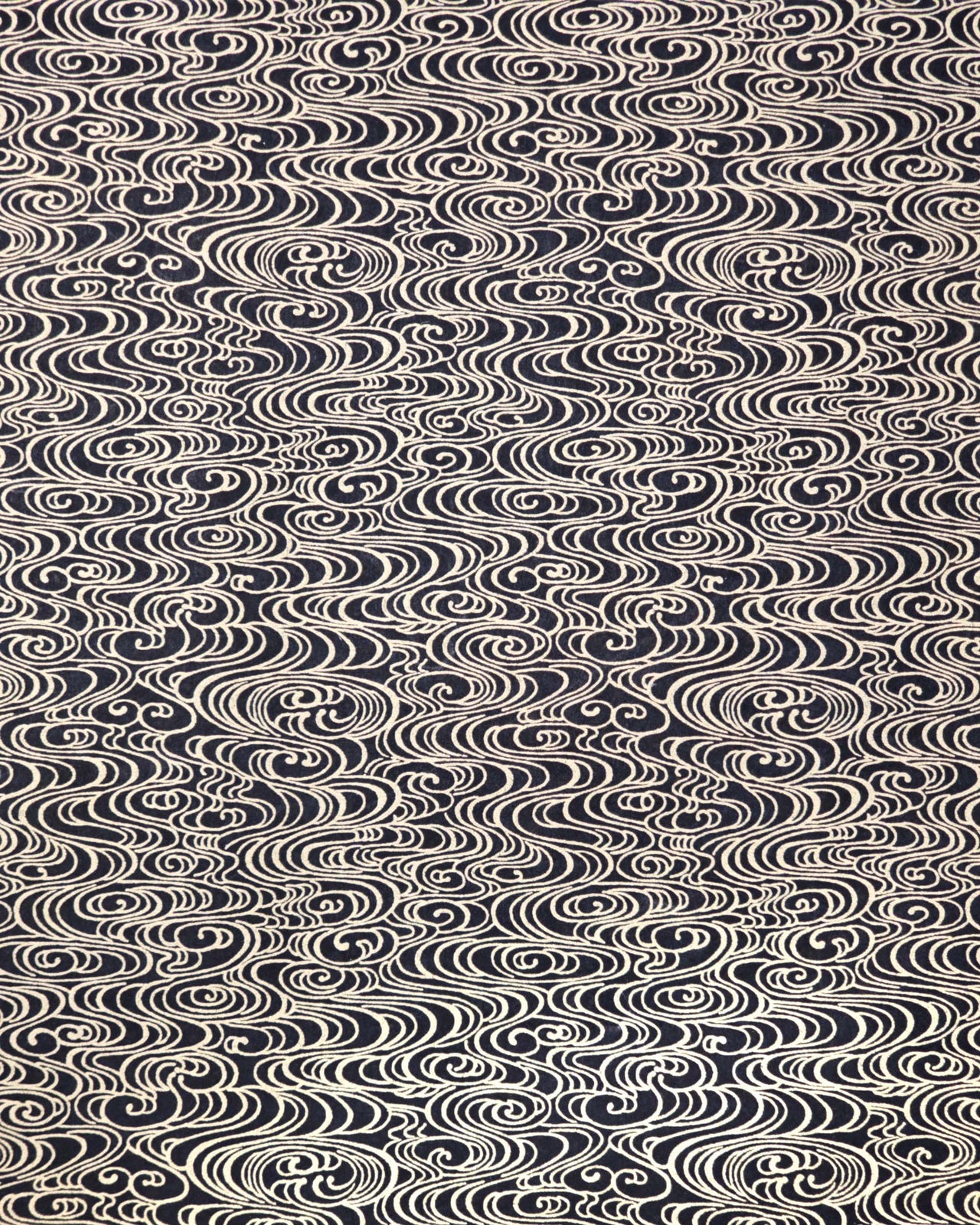 Japanese chiyogami paper featuring metallic gold water ripples on a black background.