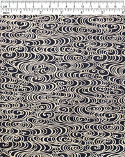 Japanese chiyogami paper featuring metallic gold water ripples on a black background.