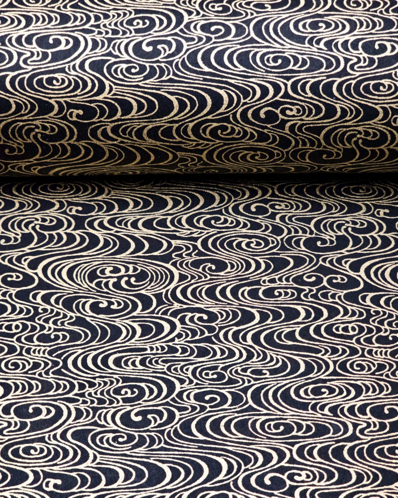 Japanese chiyogami paper featuring metallic gold water ripples on a black background.