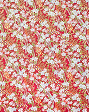 Japanese chiyogami paper featuring pink and purple plum blossoms and pink, green, and purple wisteria on a red background with metallic gold details.