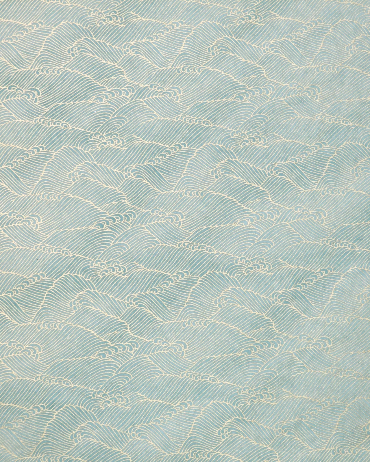 Japanese chiyogami paper featuring small metallic gold waves (aranami) on a gradient green background.
