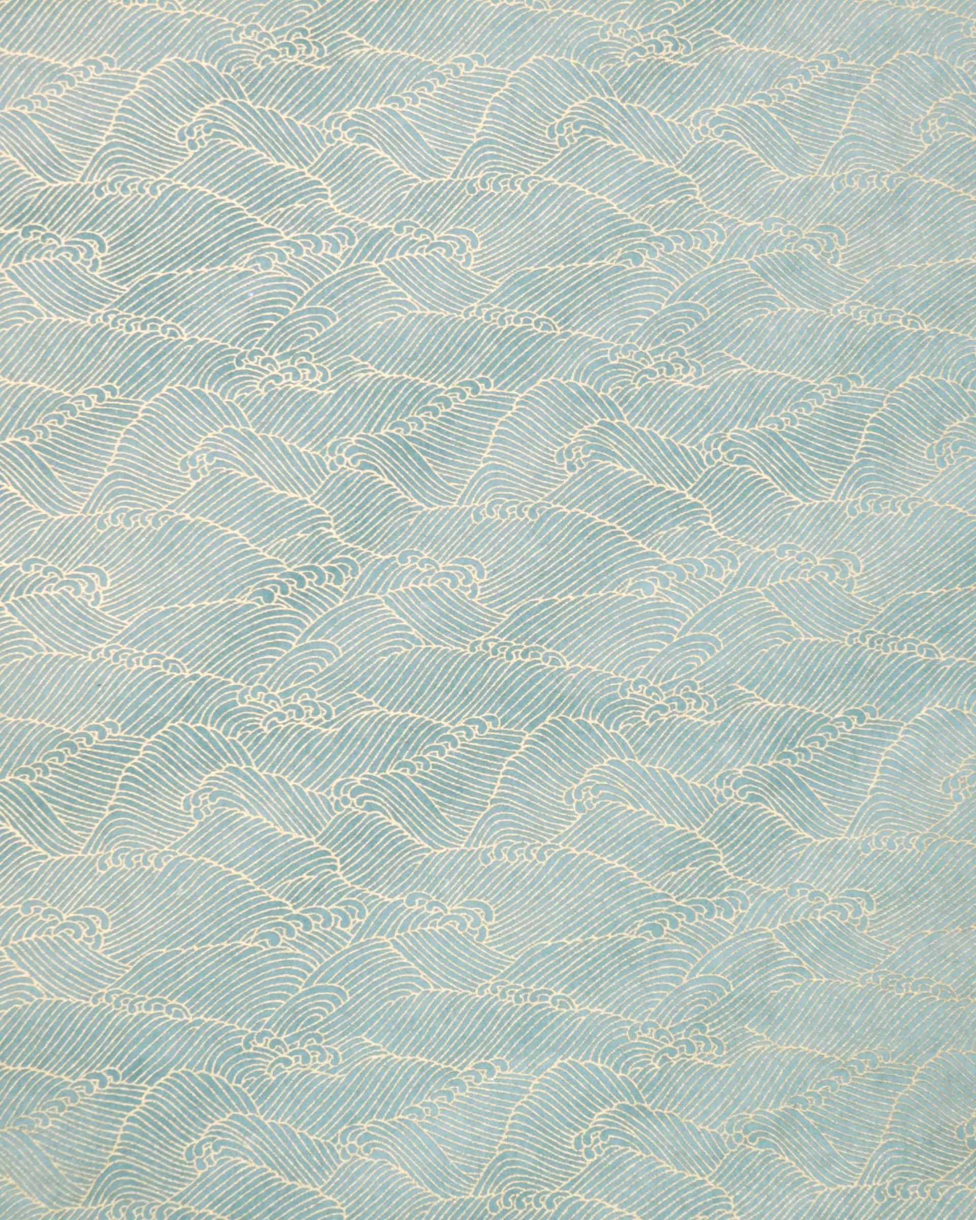 Japanese chiyogami paper featuring small metallic gold waves (aranami) on a gradient green background.