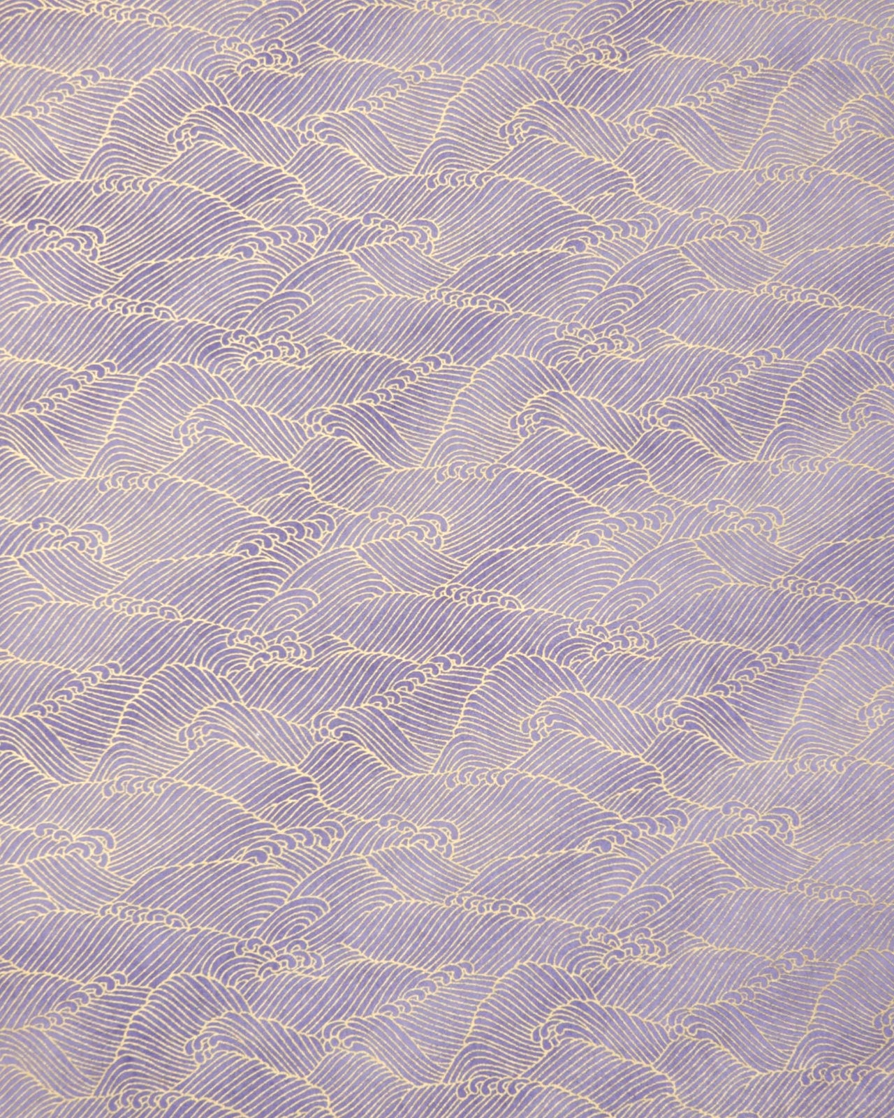 Japanese chiyogami paper featuring small metallic gold waves (aranami) on a gradient purple background.